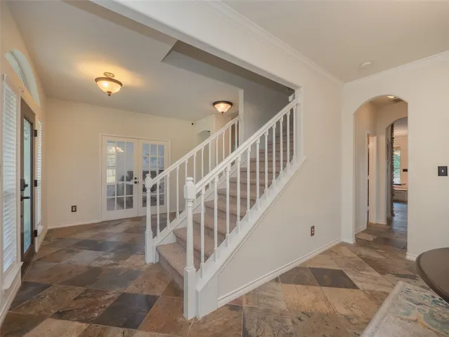 a view of a hallway with staircase