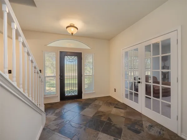 a view of an entryway with wooden floor