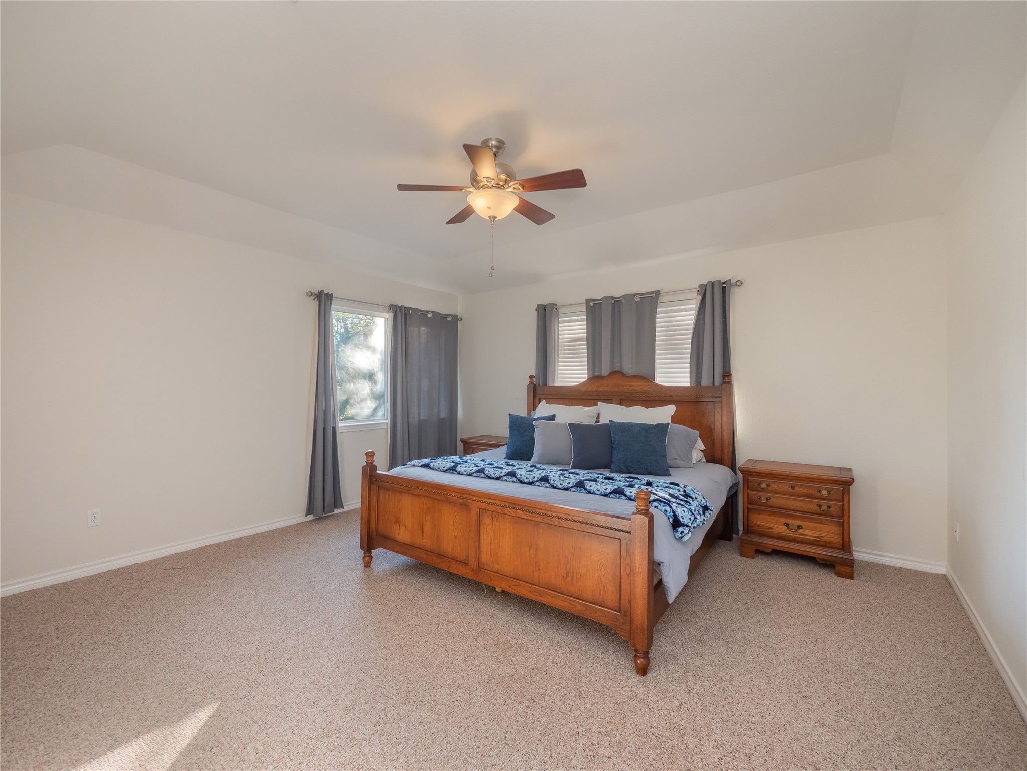 533 Arbors Circle Elgin, TX 78621 - Photo 26 of 39 a bedroom with a bed lamp and a chandelier