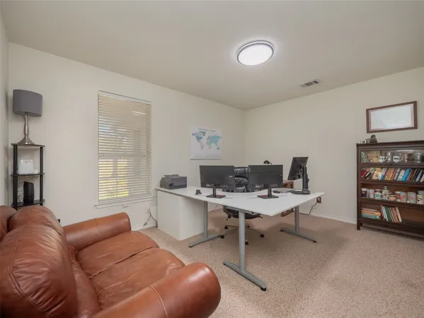 a workspace with furniture and window