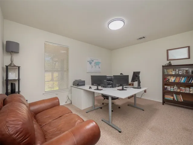 a workspace with furniture and window