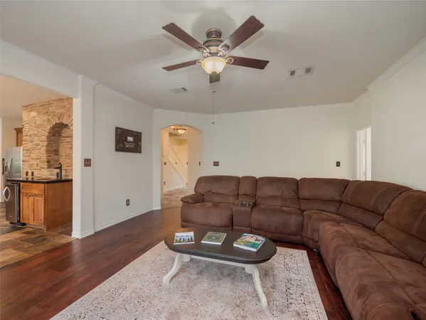 a living room with furniture and white walls