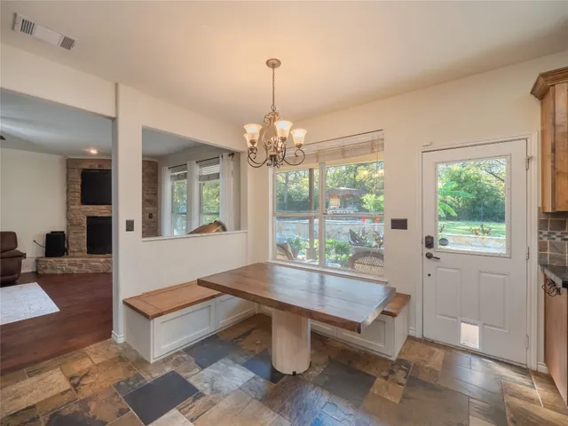 a outdoor dining space with furniture and window