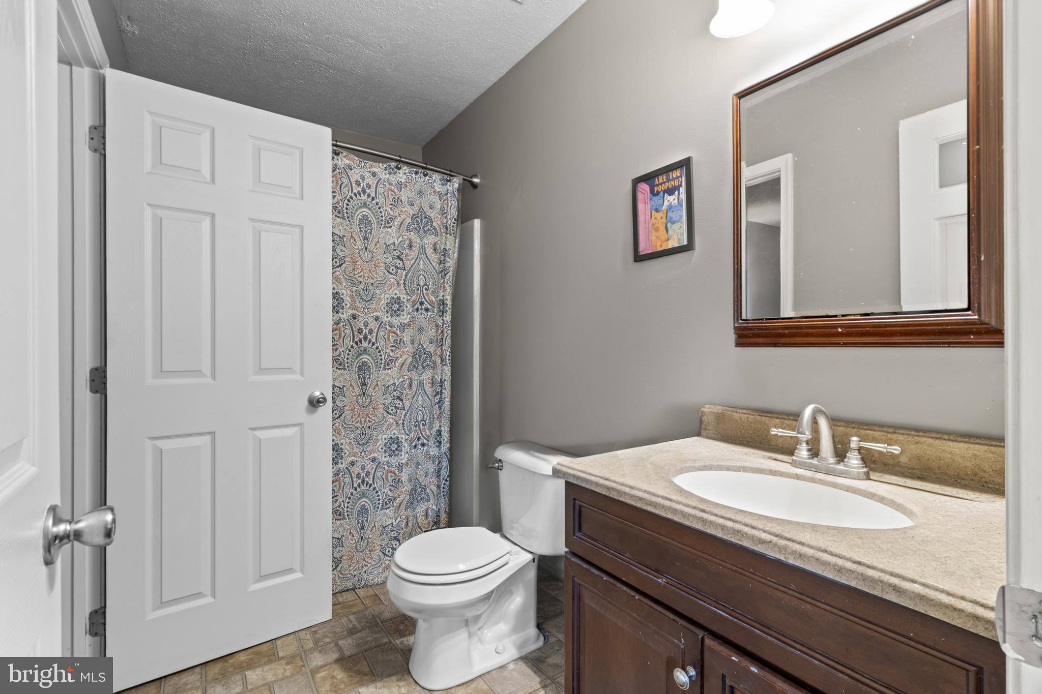 115 Balmoral Way Newark, DE 19702 - Photo 19 of 31 a bathroom with a sink toilet and shower