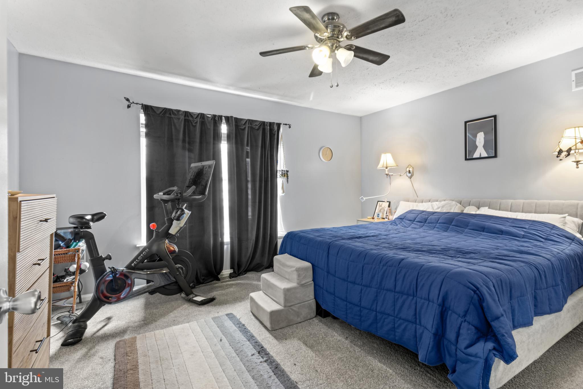 115 Balmoral Way Newark, DE 19702 - Photo 23 of 31 a bedroom with a bed and a ceiling fan
