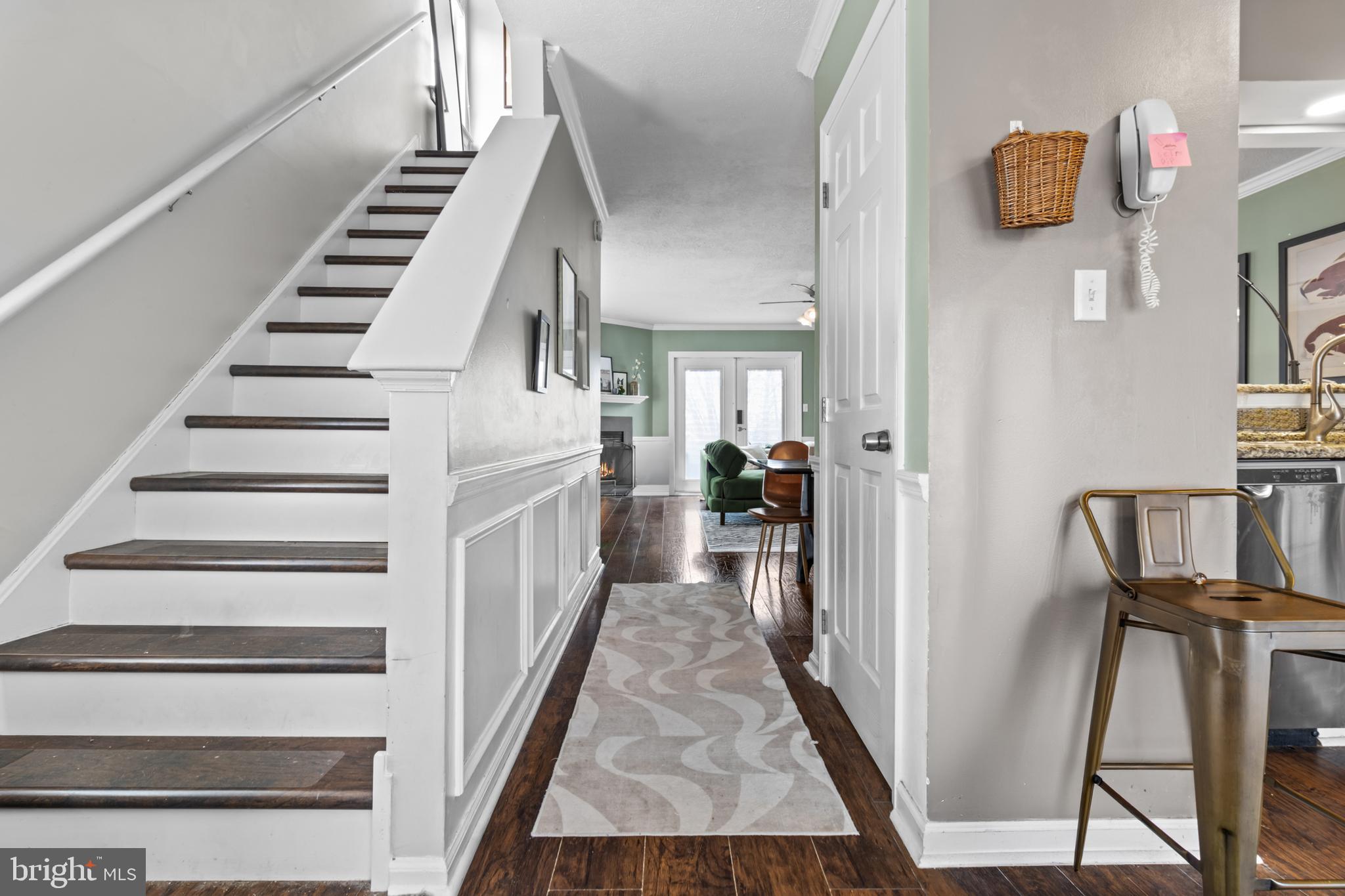 115 Balmoral Way Newark, DE 19702 - Photo 5 of 31 a view of a hallway with wooden floor and staircase