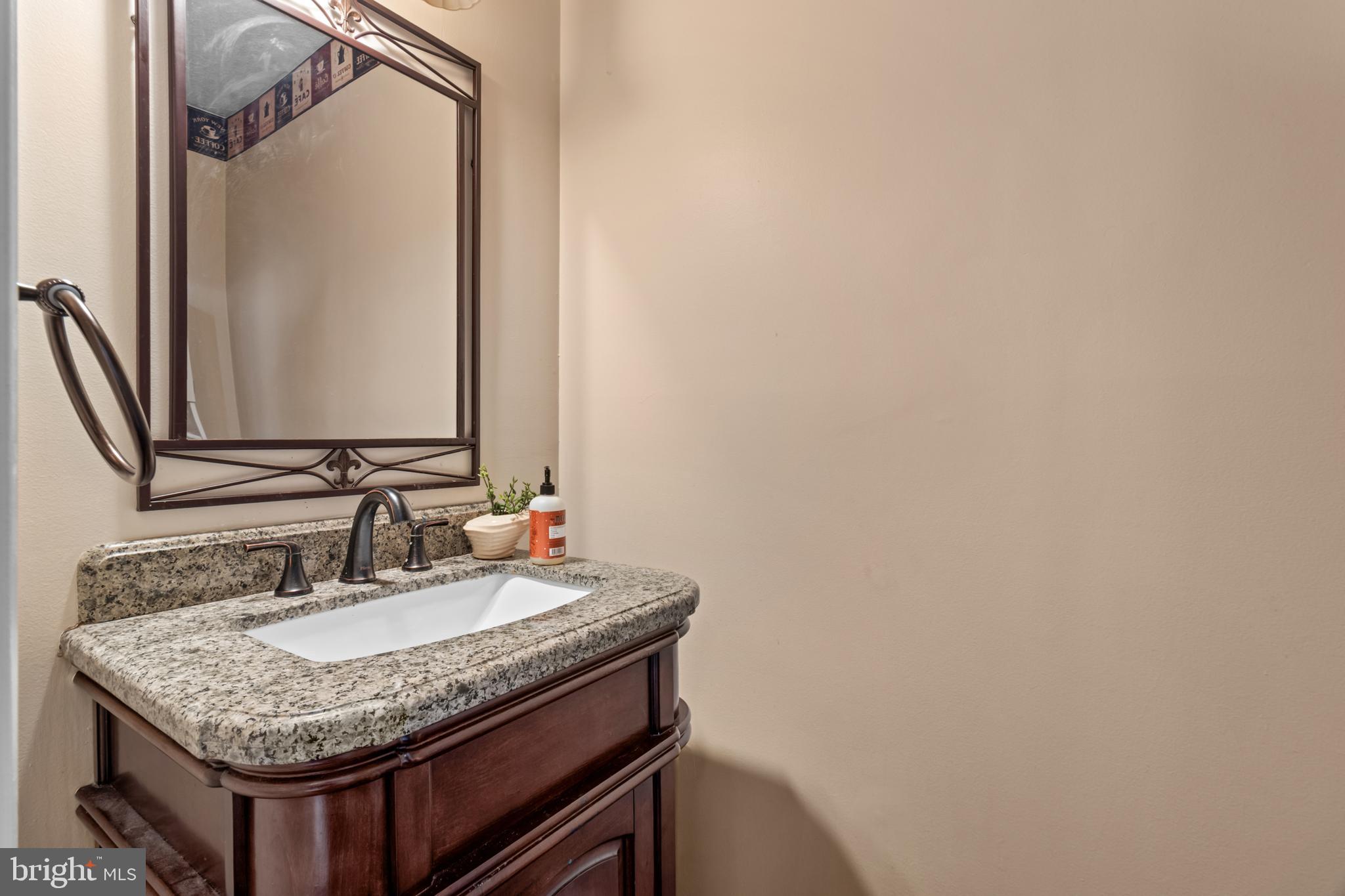 115 Balmoral Way Newark, DE 19702 - Photo 6 of 31 a bathroom with a granite countertop sink and a mirror
