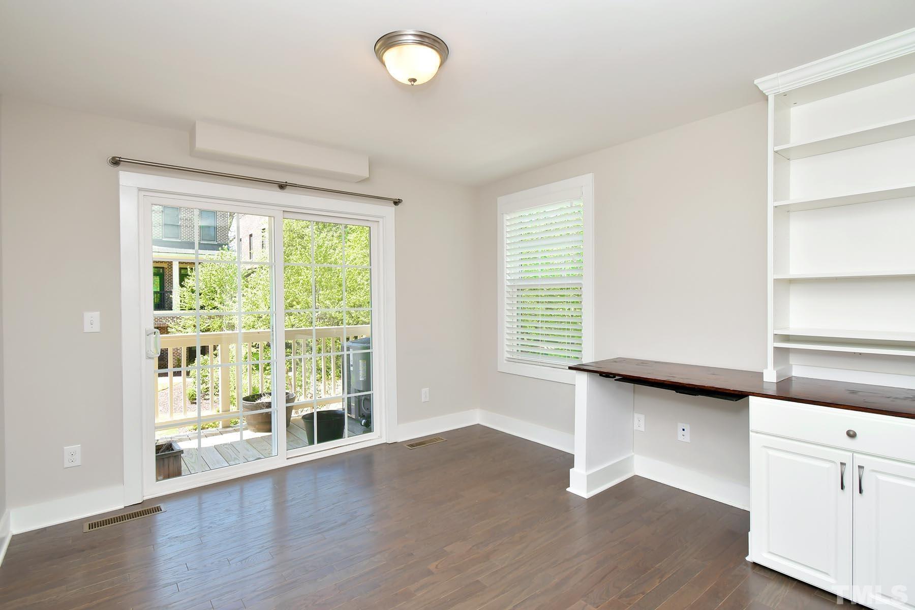 511 North Person Street, Unit 107 Raleigh, NC 27604 - Photo 14 of 36 Separate office with built-ins that opens onto the deck