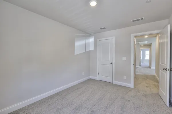 a bathroom with a sink toilet vanity and shower
