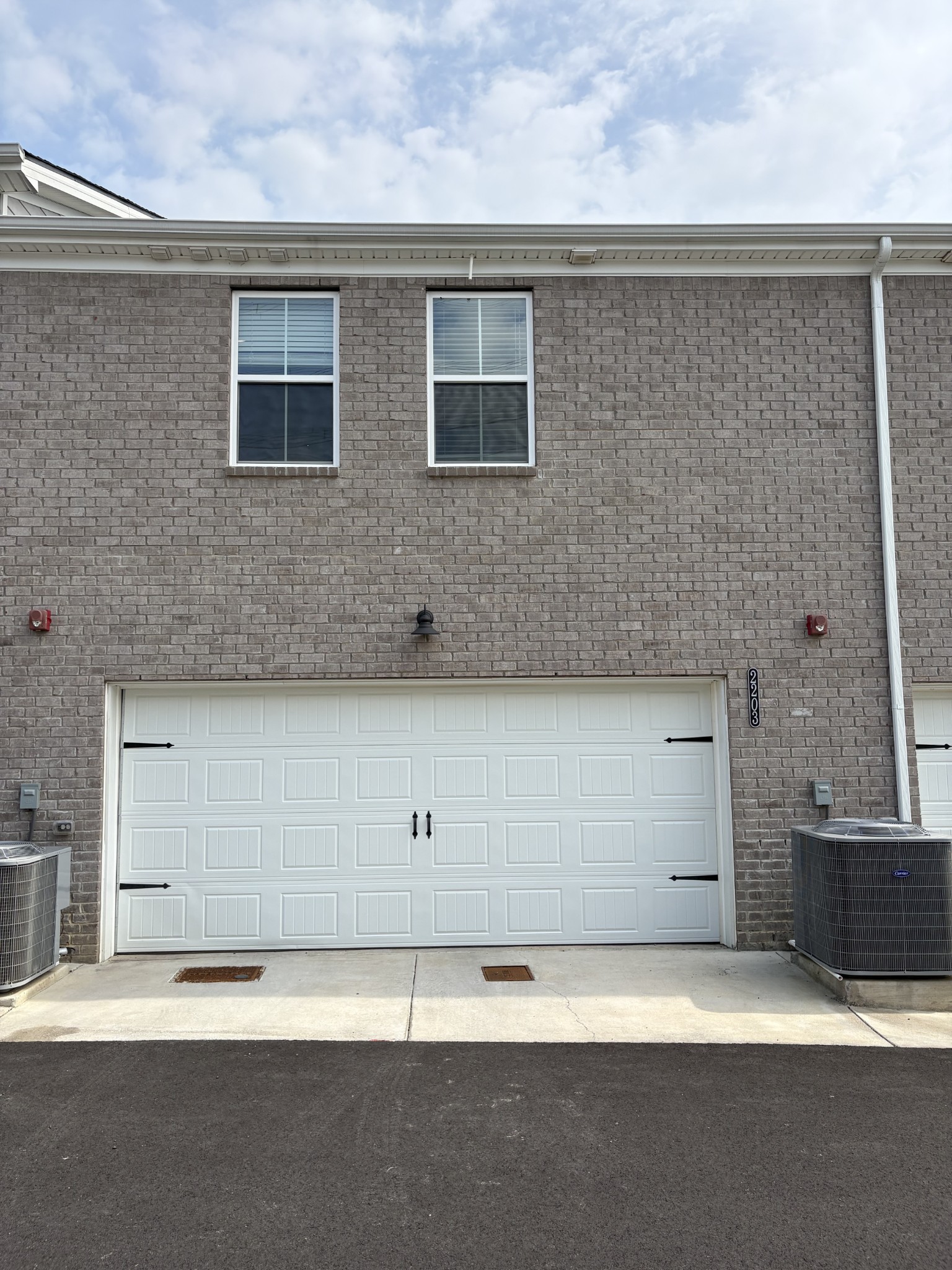 204 Douglas Bend Road, Unit 2203 Gallatin, TN 37066 - Photo 20 of 20 a view of a brick house with a parking space