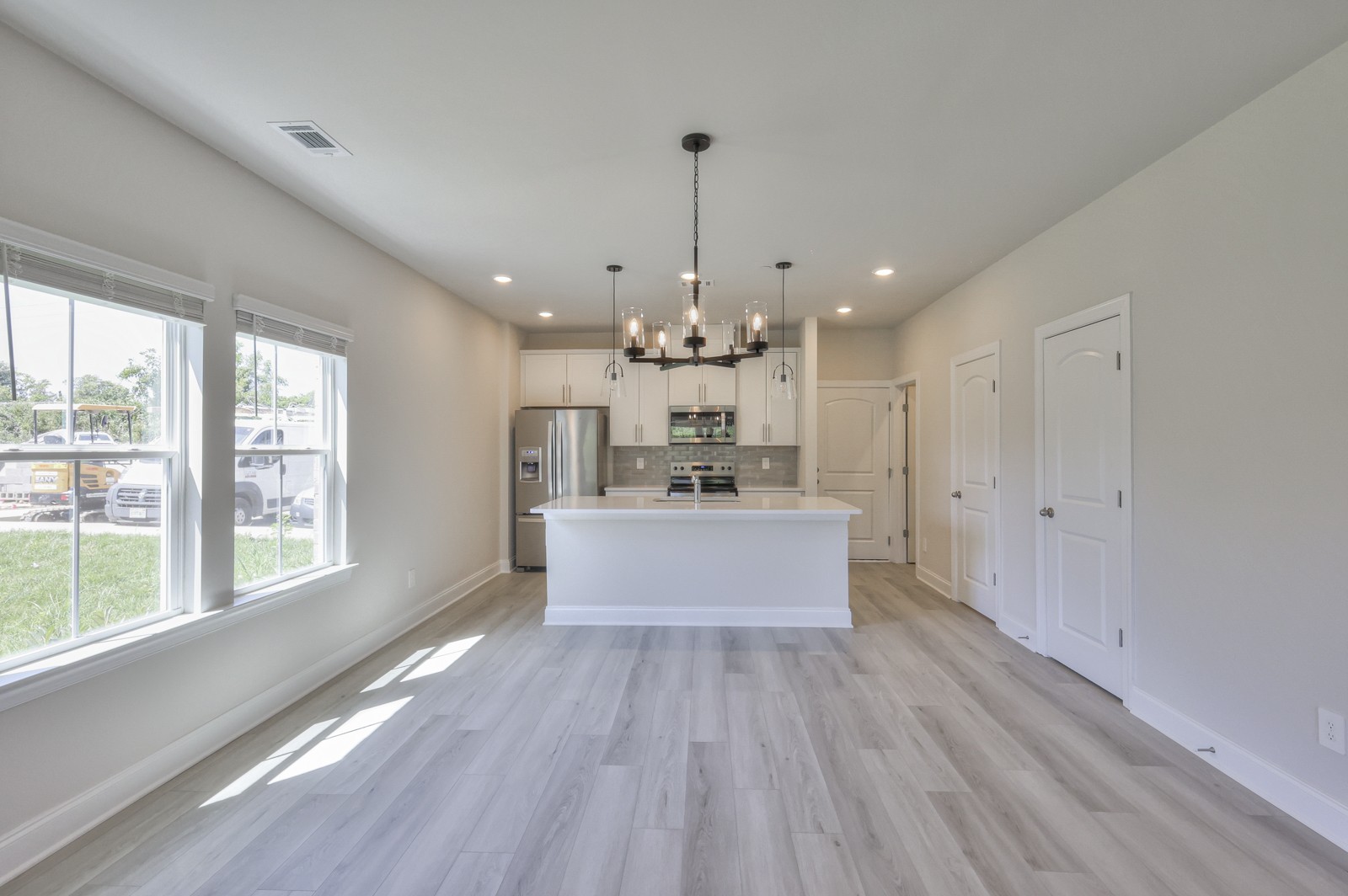 204 Douglas Bend Road, Unit 2203 Gallatin, TN 37066 - Photo 2 of 20 a large kitchen with kitchen island a large island in the center and stainless steel appliances
