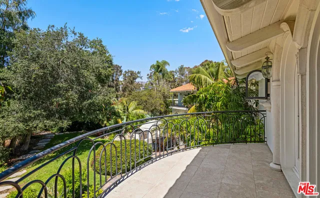 a view of a balcony with an outdoor space