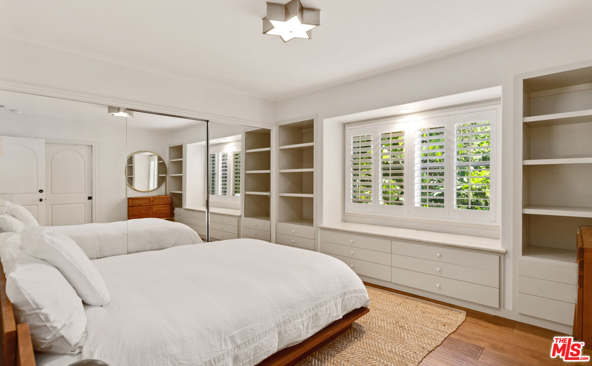 28899 Cliffside Drive Malibu, CA 90265 - Photo 27 of 53 a bedroom with a large bed and a large window