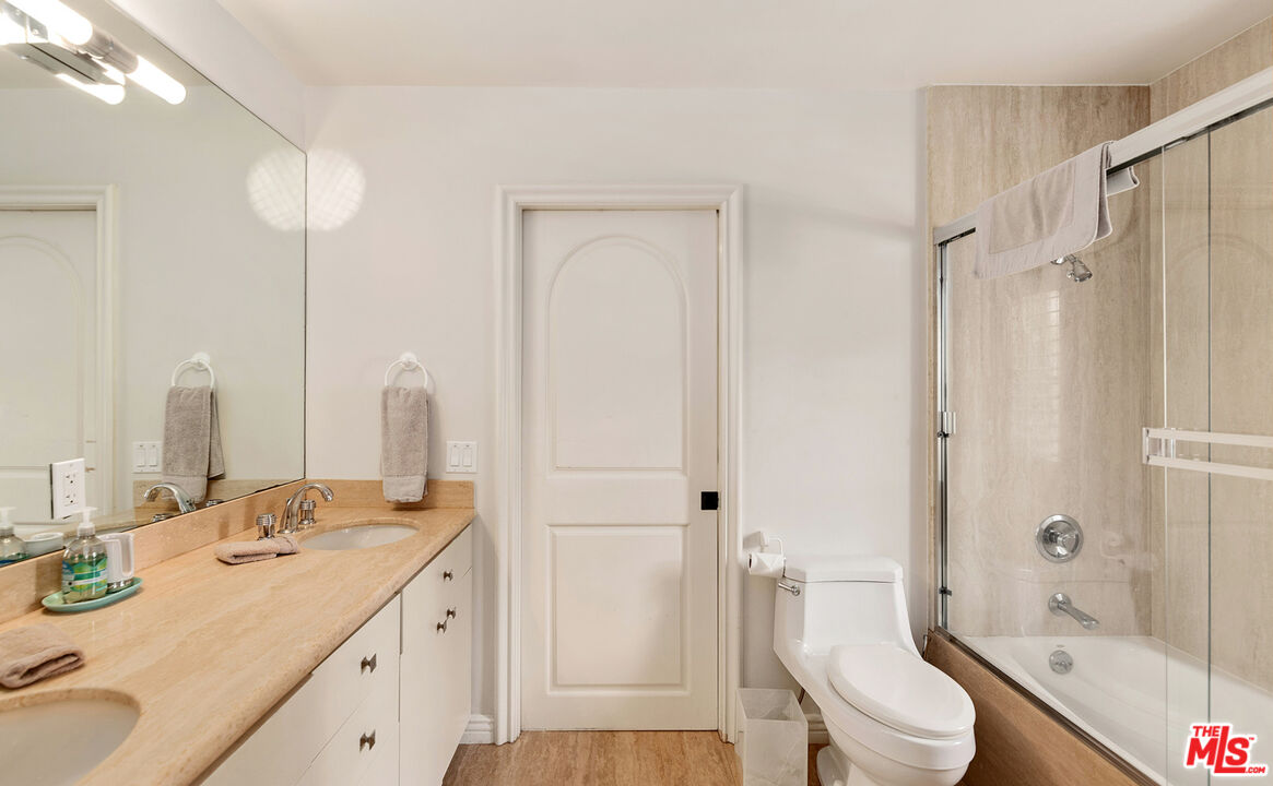 28899 Cliffside Drive Malibu, CA 90265 - Photo 28 of 53 a bathroom with a granite countertop sink toilet and shower