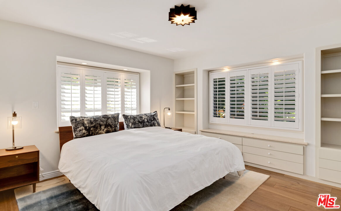 28899 Cliffside Drive Malibu, CA 90265 - Photo 29 of 53 a large bed sitting in a bedroom next to a window