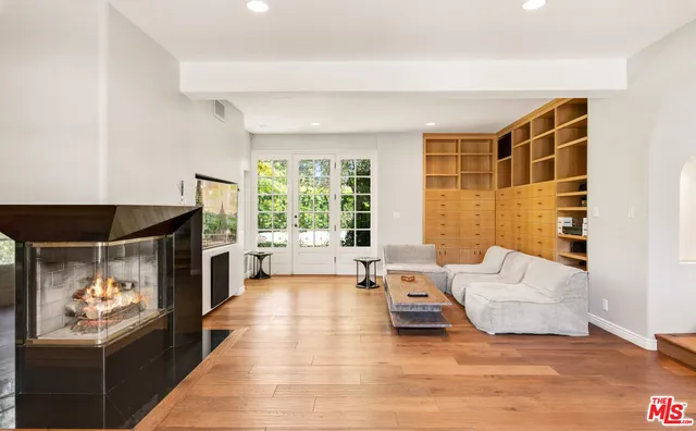 a view of an empty room and a window