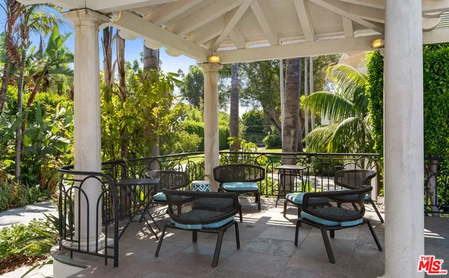 a view of a backyard with sitting area