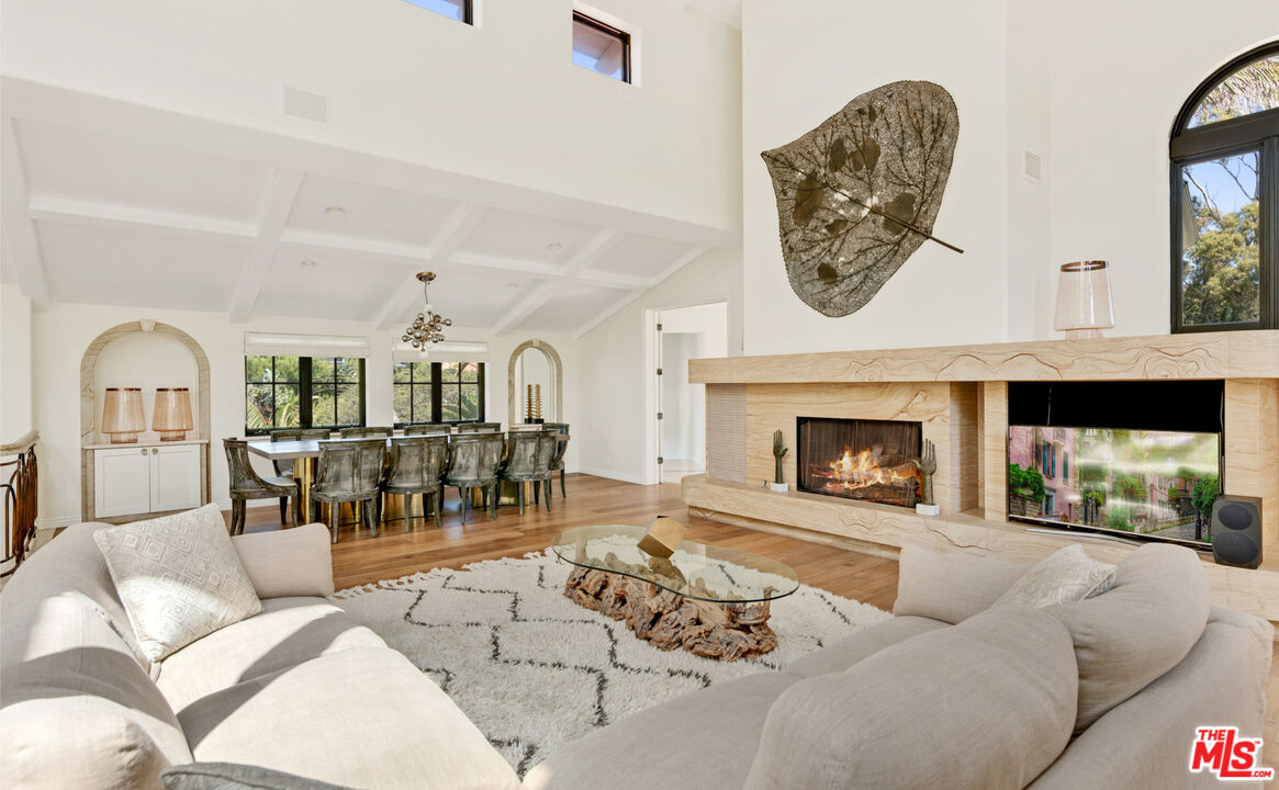 28899 Cliffside Drive Malibu, CA 90265 - Photo 9 of 53 a living room with furniture a fireplace and a fireplace