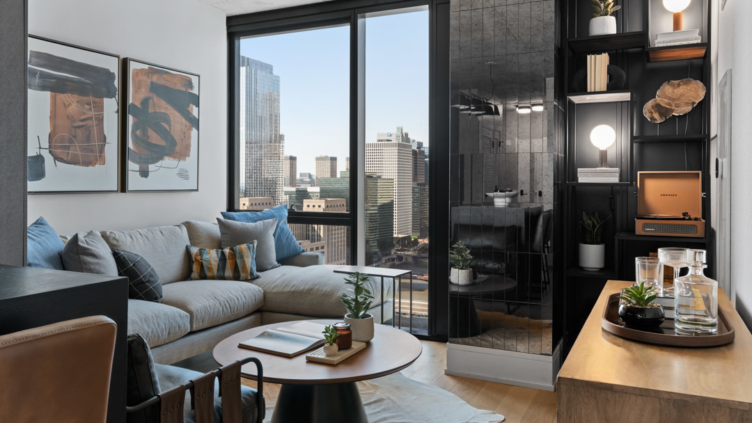 234 West Polk Street, Unit 3106 Chicago, IL 60607 - Photo 2 of 17 a living room with furniture and a mirror