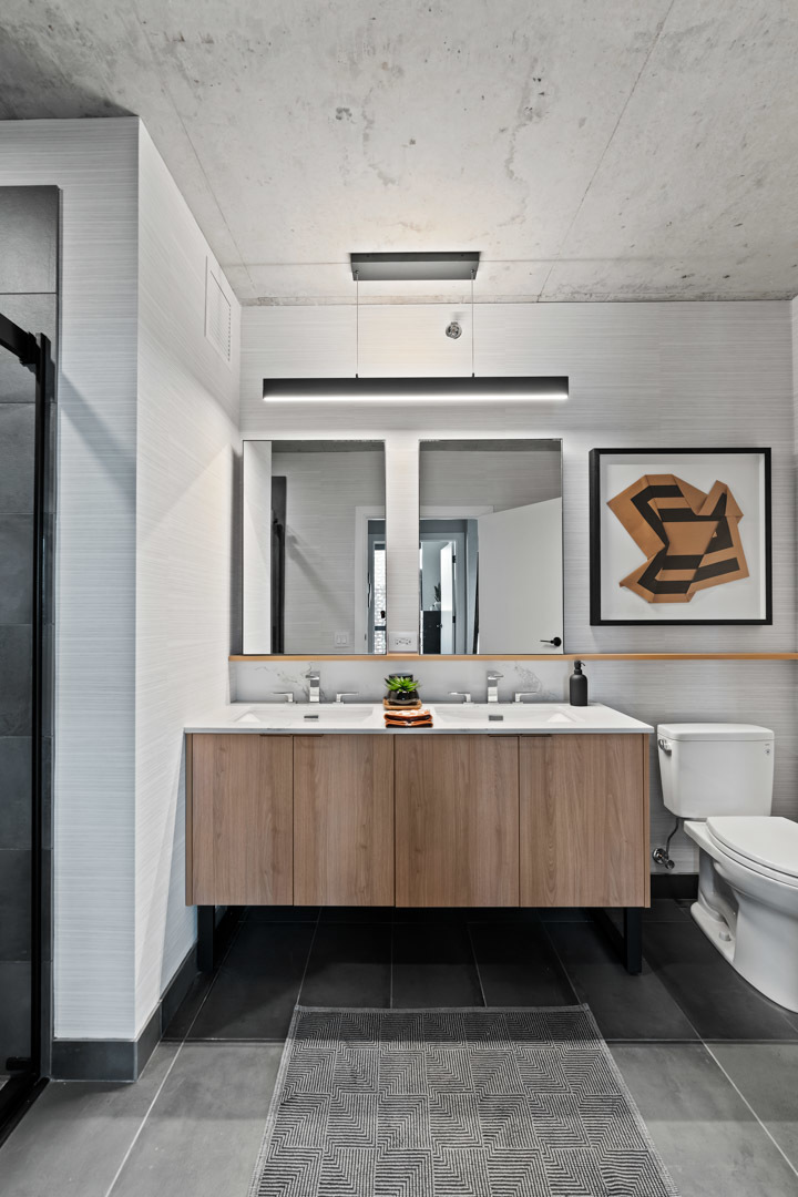 234 West Polk Street, Unit 3106 Chicago, IL 60607 - Photo 6 of 17 a living room with a sink and mirror