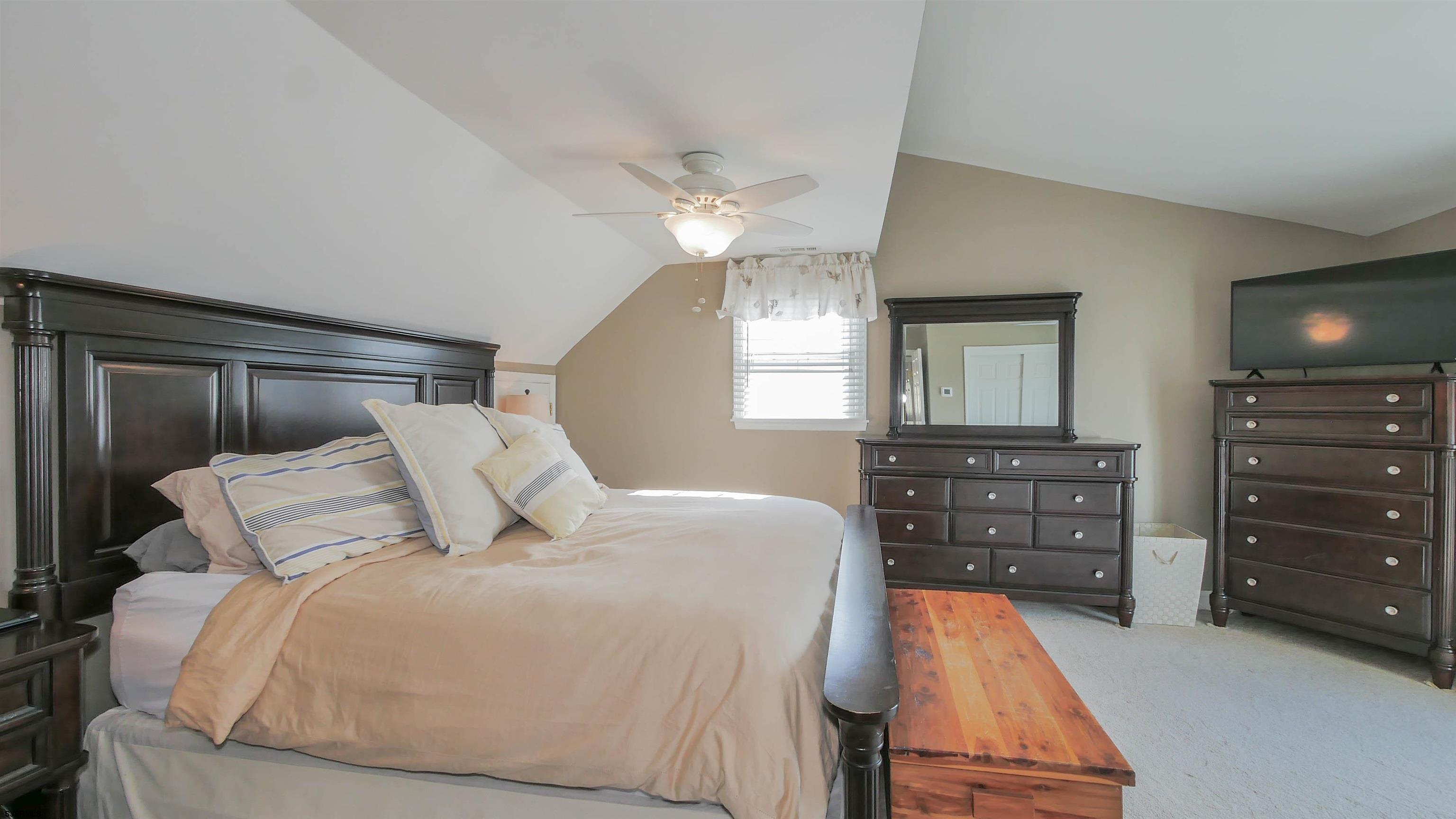 16 Spruce Road Ocean City, NJ 08226 - Photo 21 of 41 a bedroom with a bed and a dresser