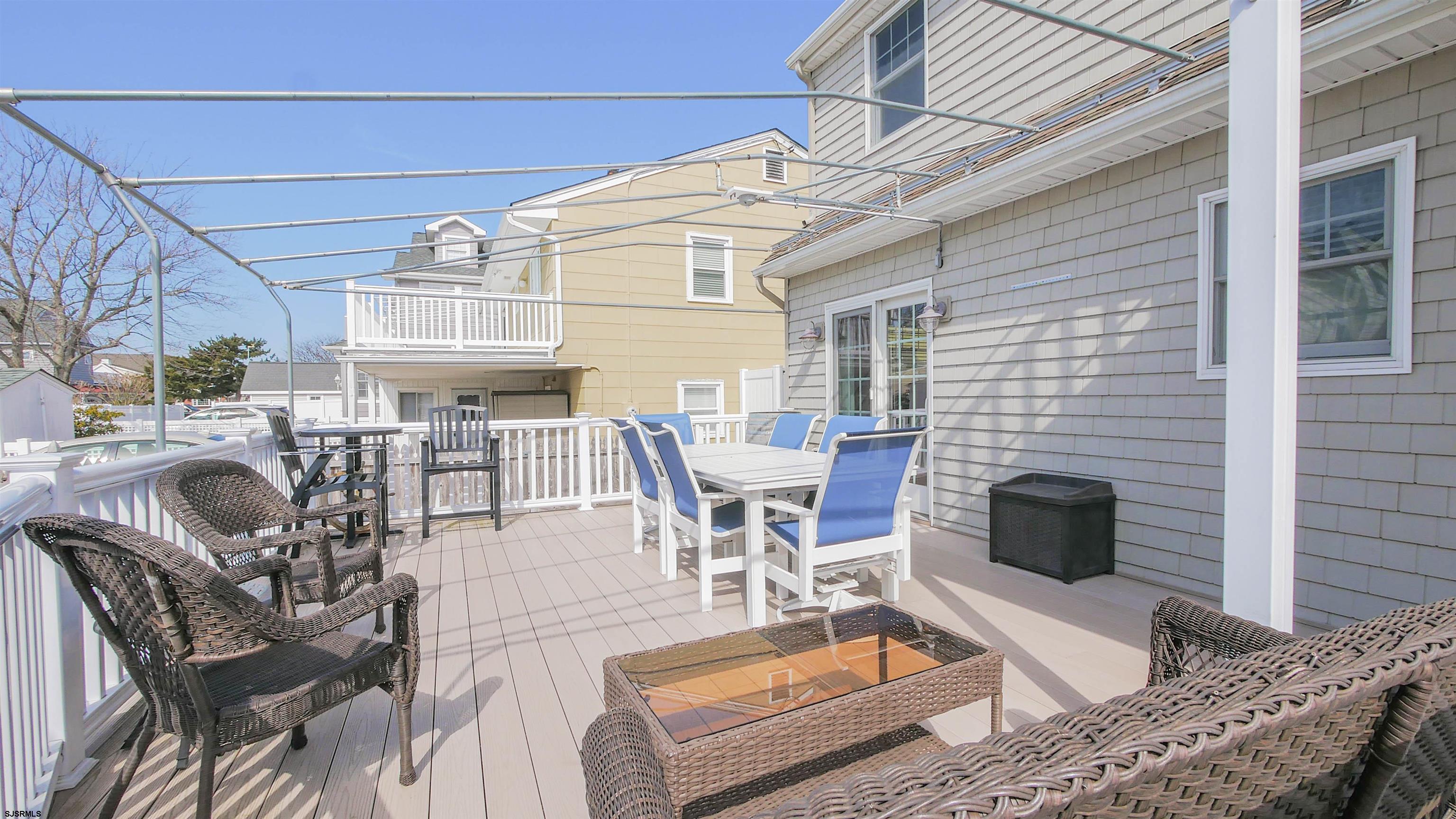 16 Spruce Road Ocean City, NJ 08226 - Photo 35 of 41 a view of a patio with table and chairs