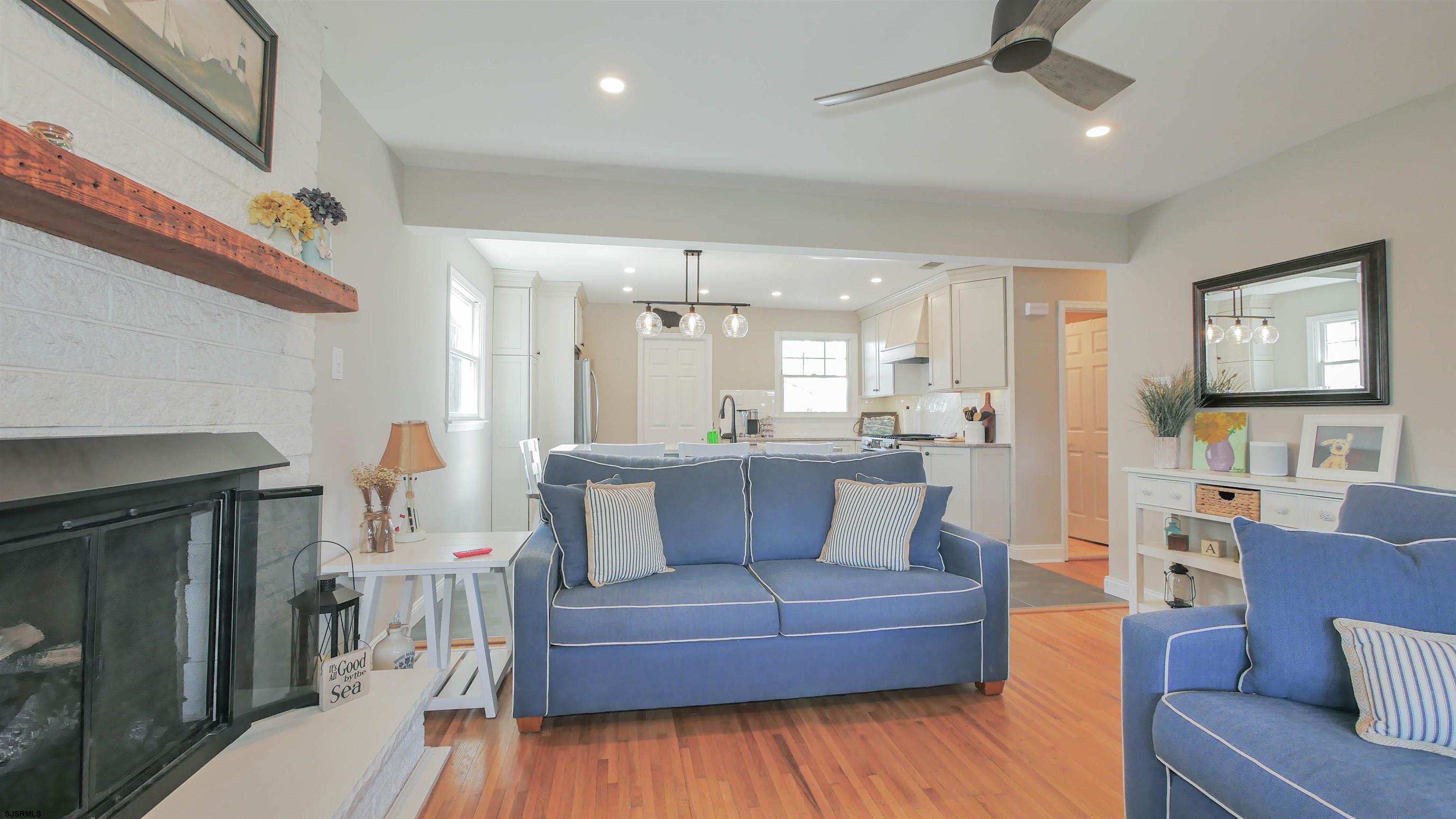 16 Spruce Road Ocean City, NJ 08226 - Photo 8 of 41 a living room with furniture and a fireplace