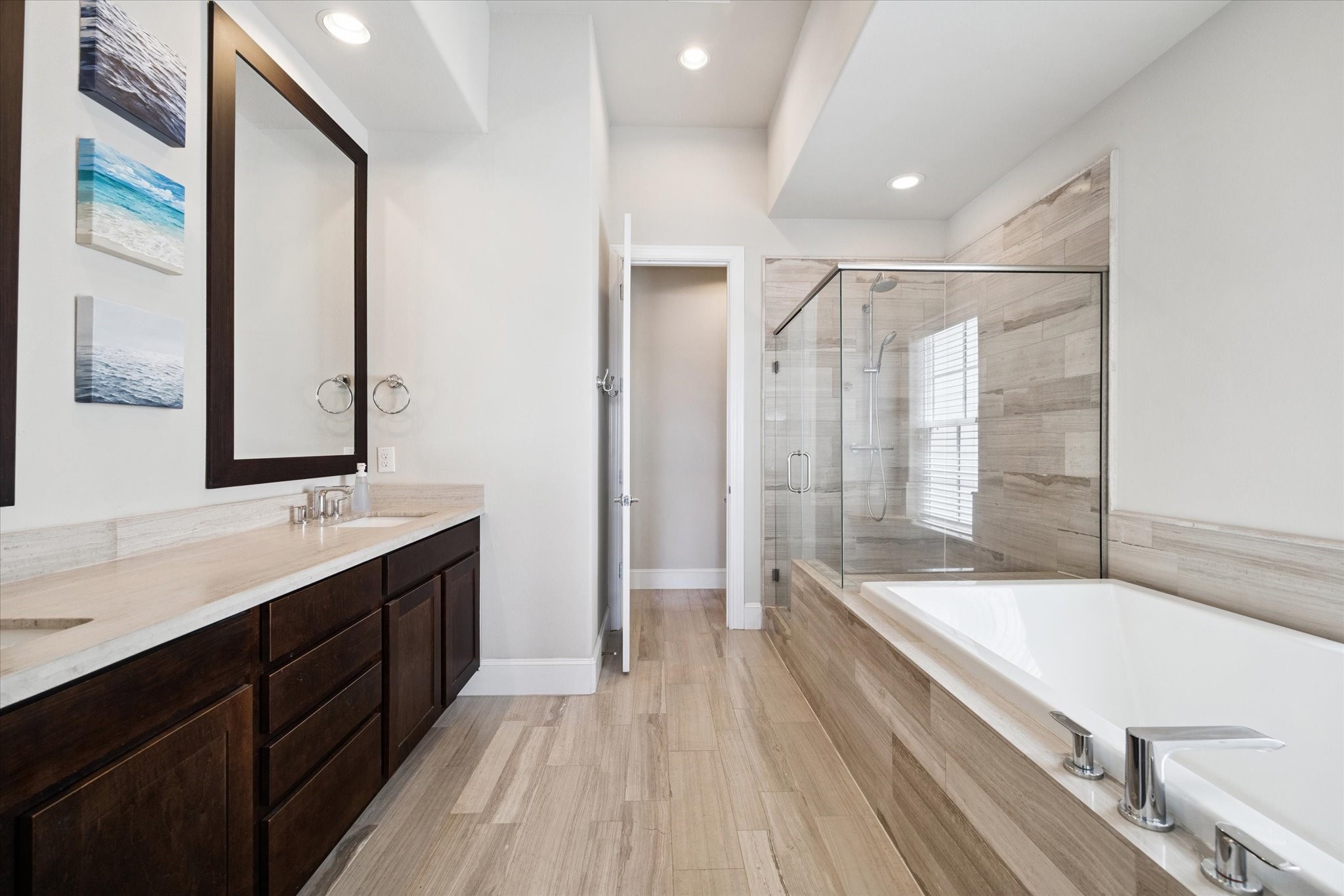 2006 Lou Ellen Lane, Unit H Houston, TX 77018 - Photo 17 of 42 a bathroom with a double vanity sink a large mirror and shower