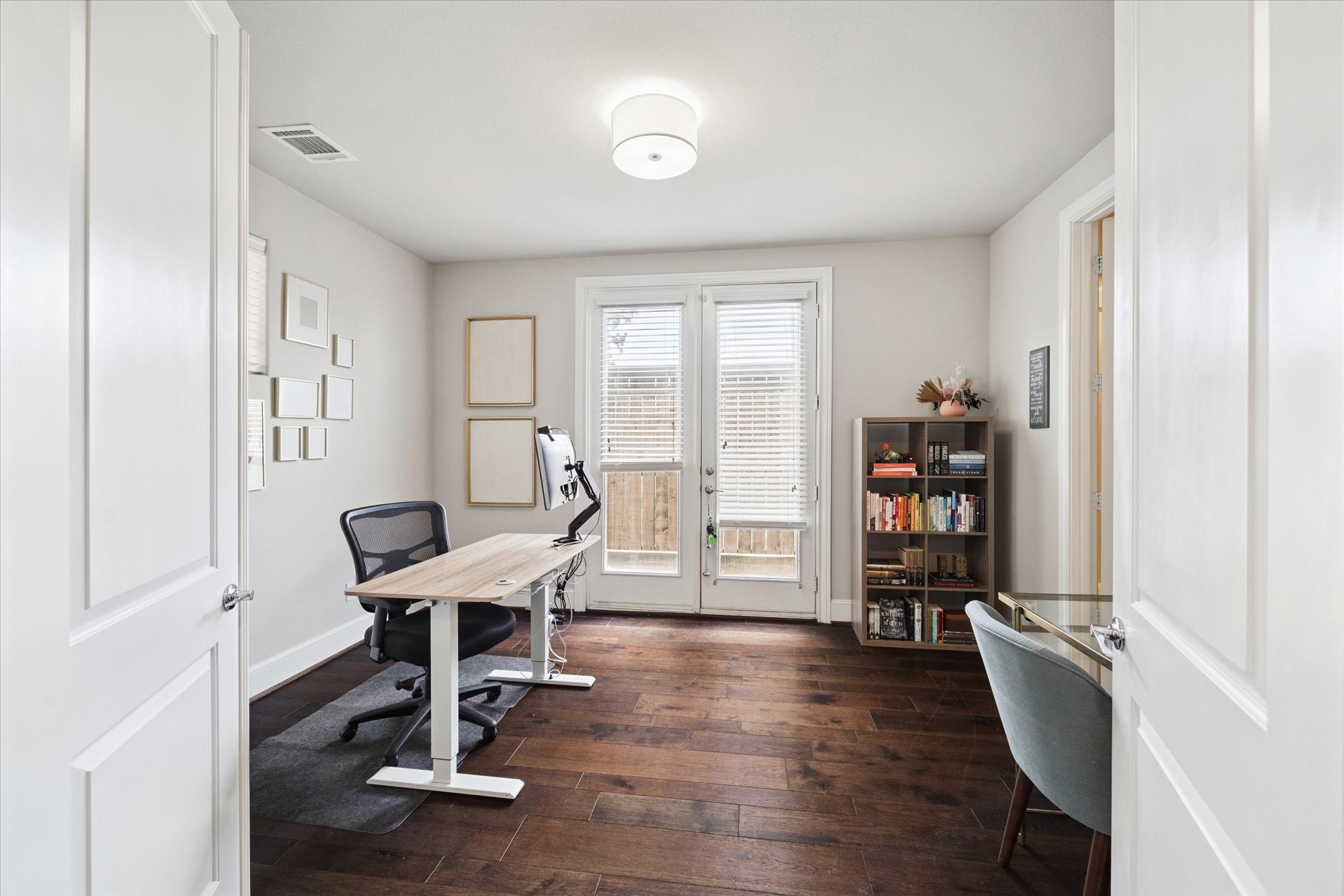 2006 Lou Ellen Lane, Unit H Houston, TX 77018 - Photo 4 of 42 a view of a workspace with furniture and a window
