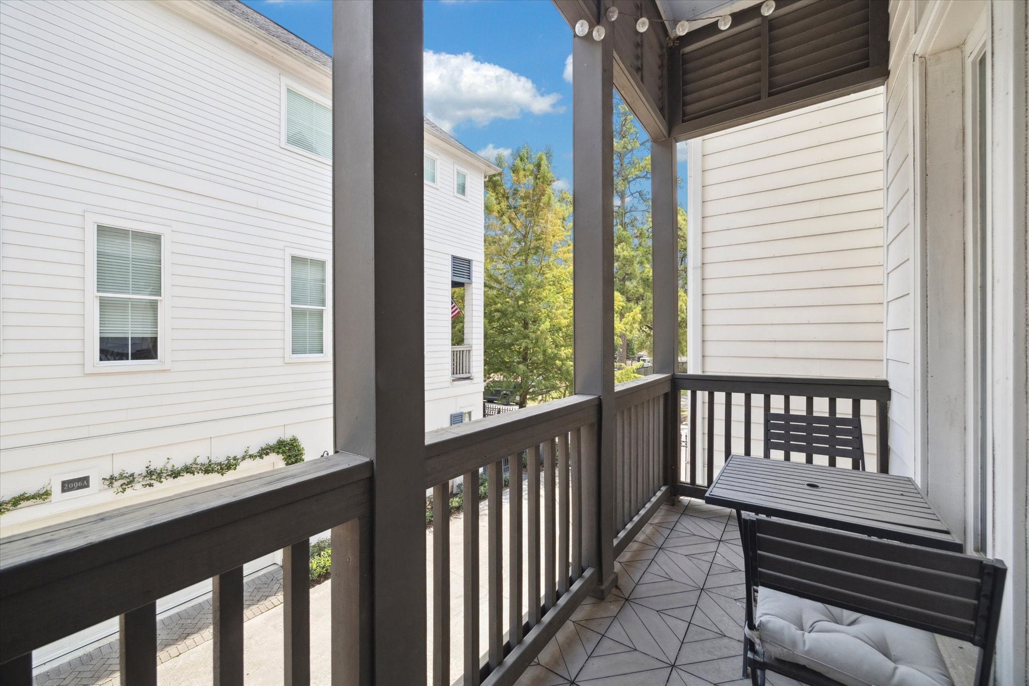 2006 Lou Ellen Lane, Unit H Houston, TX 77018 - Photo 8 of 42 a view of a balcony with wooden floor and outdoor space