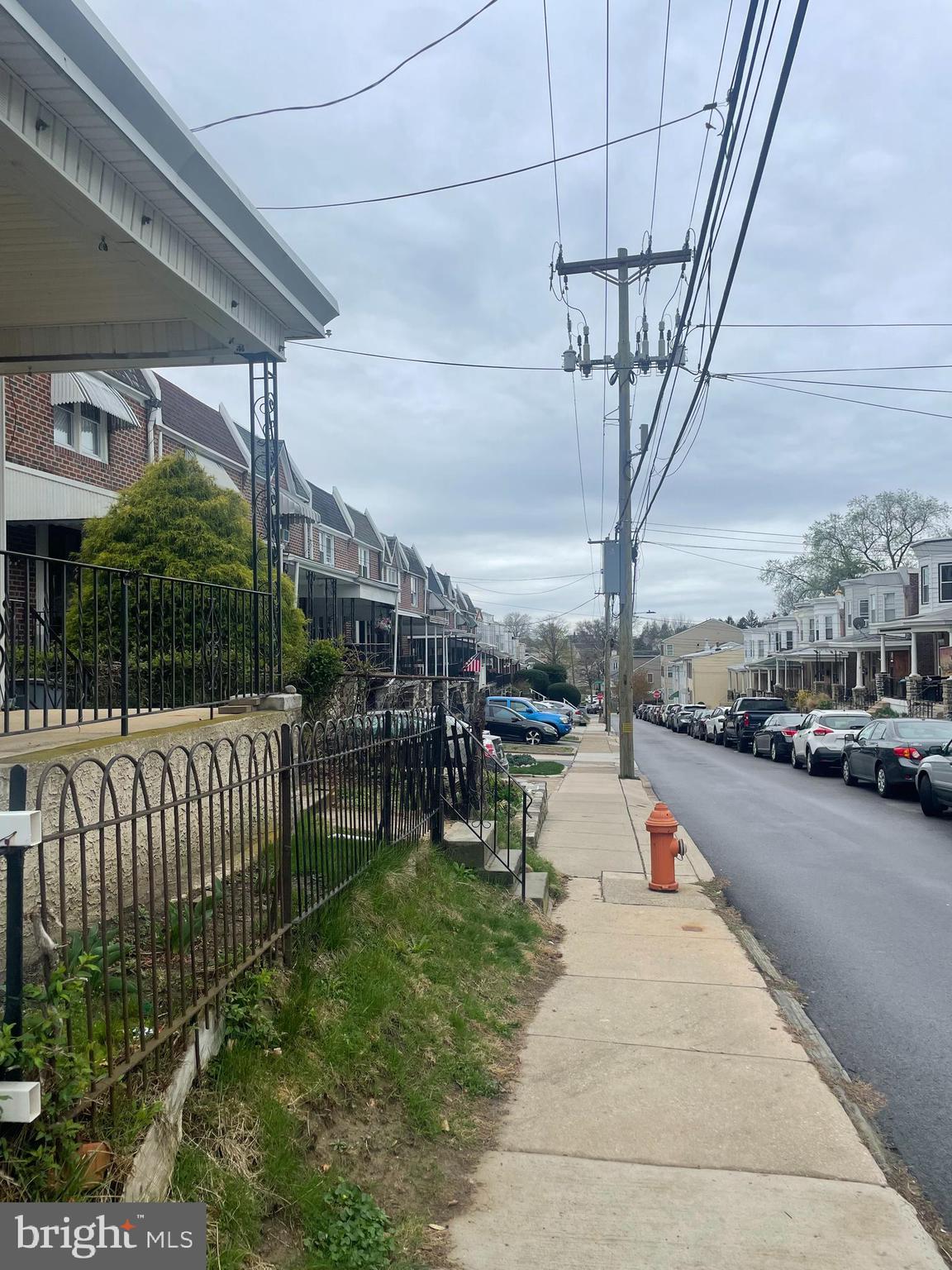 449 Delmar Street Philadelphia, PA 19128 - Photo 12 of 13 a view of a porch with furniture and a yard