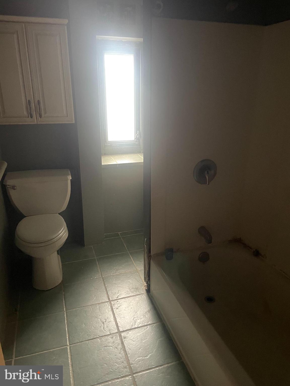 449 Delmar Street Philadelphia, PA 19128 - Photo 6 of 13 a bathroom with a toilet and a shower