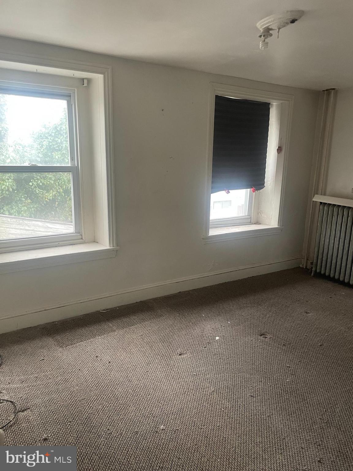 449 Delmar Street Philadelphia, PA 19128 - Photo 7 of 13 an empty room with a window