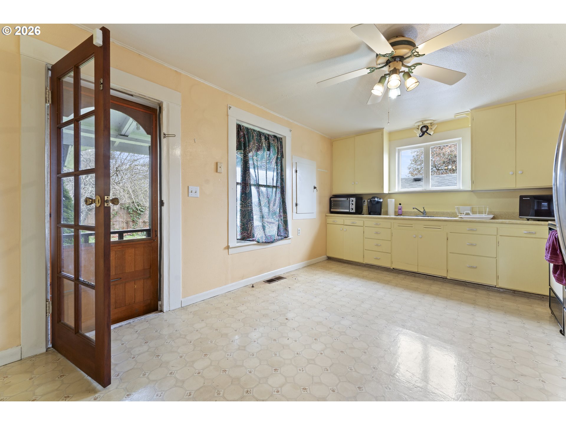 642 Clark Street North Bend, OR 97459 - Photo 11 of 29 a view of an empty room with window and cabinet