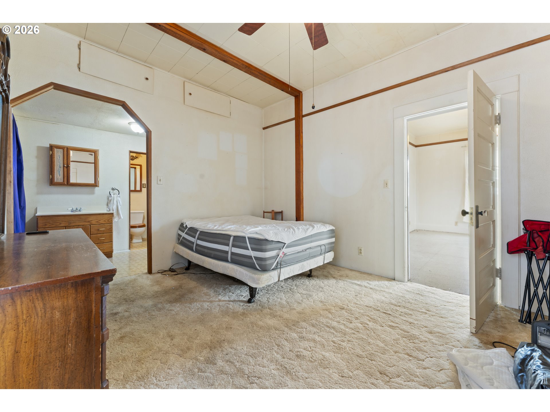 642 Clark Street North Bend, OR 97459 - Photo 12 of 29 a bedroom with a bed and a dresser