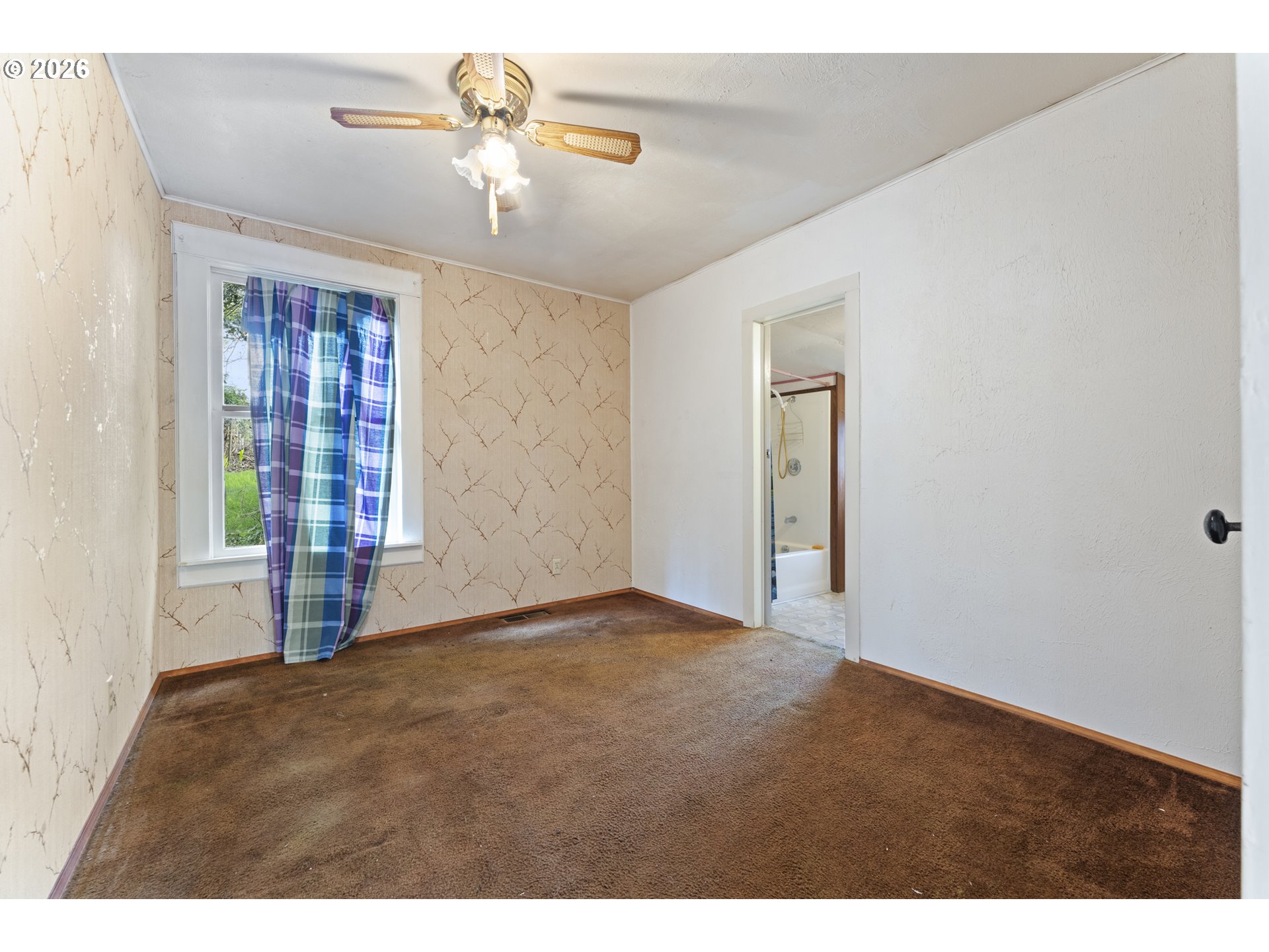 642 Clark Street North Bend, OR 97459 - Photo 17 of 29 a view of an empty room with a window