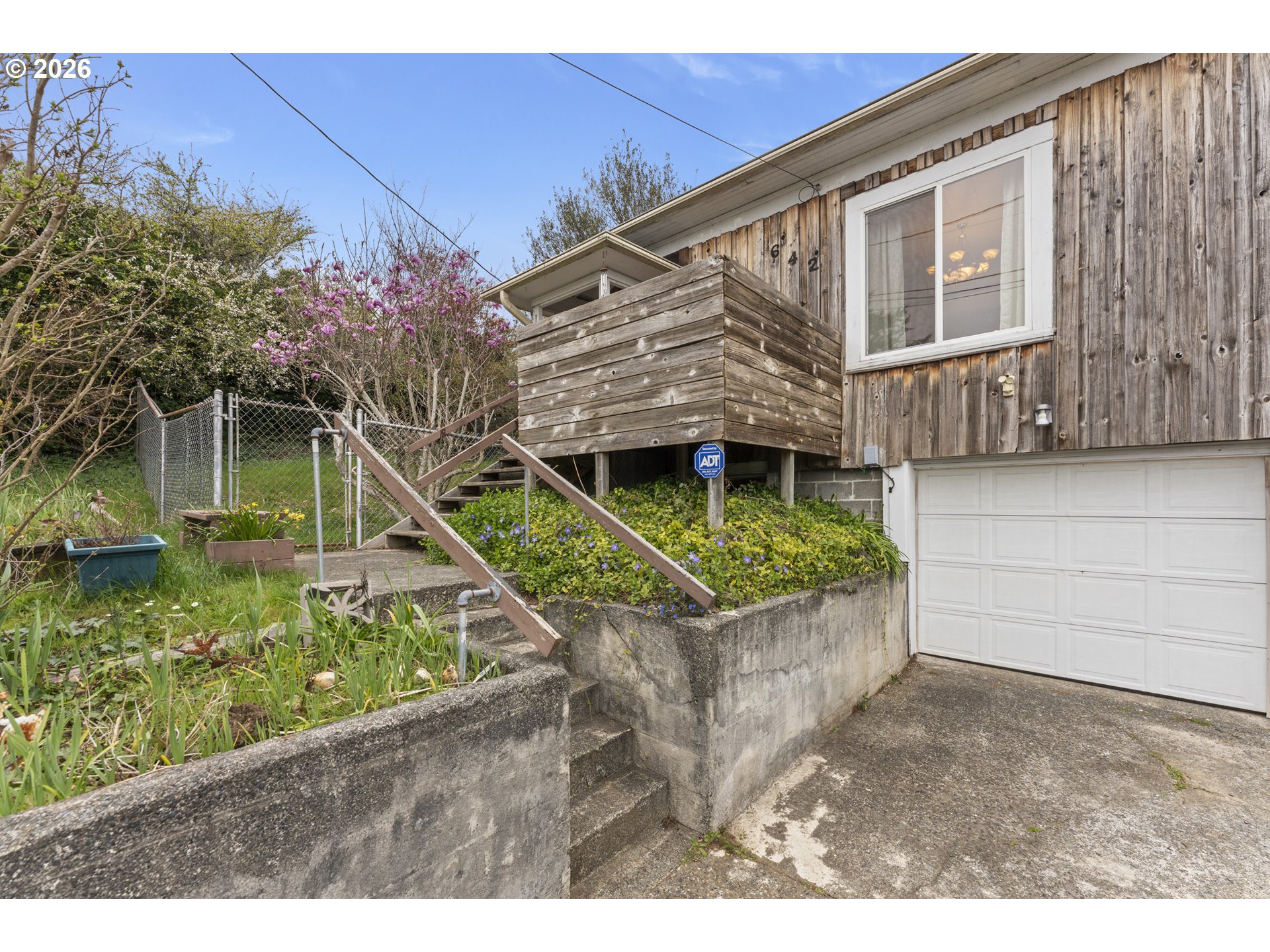 642 Clark Street North Bend, OR 97459 - Photo 2 of 29 a front view of a house with a yard