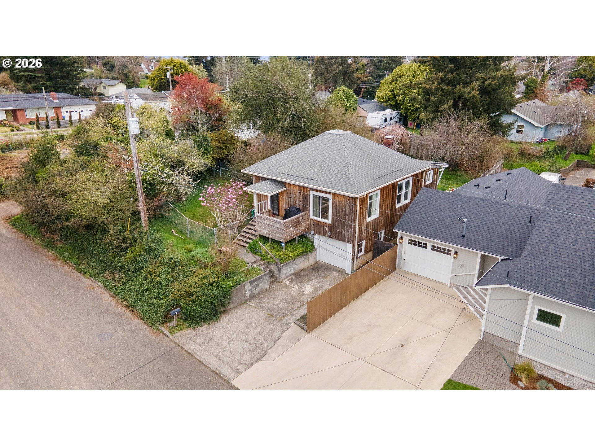 642 Clark Street North Bend, OR 97459 - Photo 27 of 29 a upper view of a house with a yard