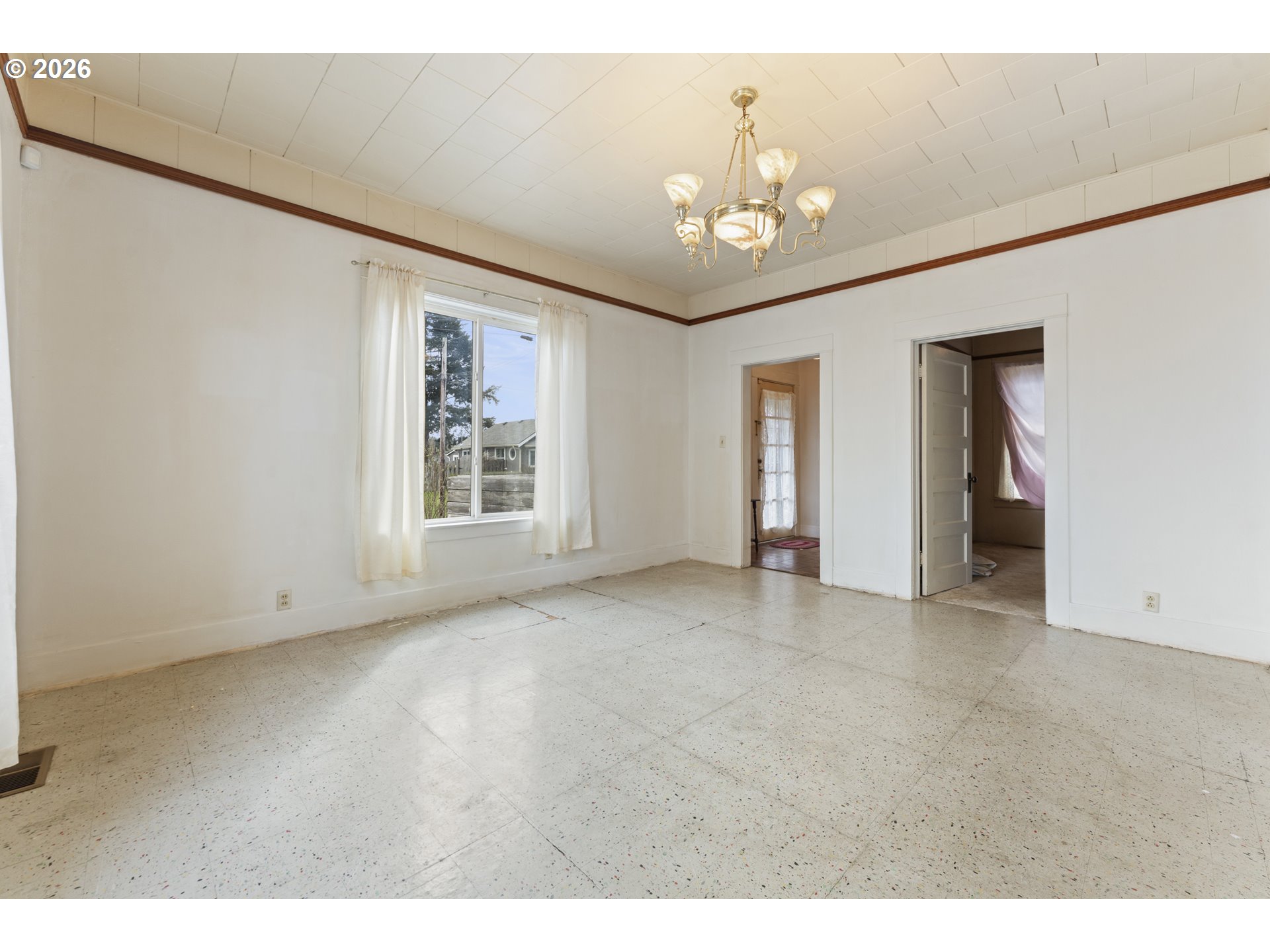 642 Clark Street North Bend, OR 97459 - Photo 5 of 29 a view of an empty room with a window