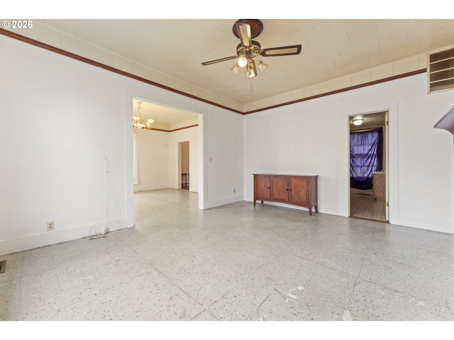 642 Clark Street North Bend, OR 97459 - Photo 6 of 29 a view of an empty room with a chandelier fan