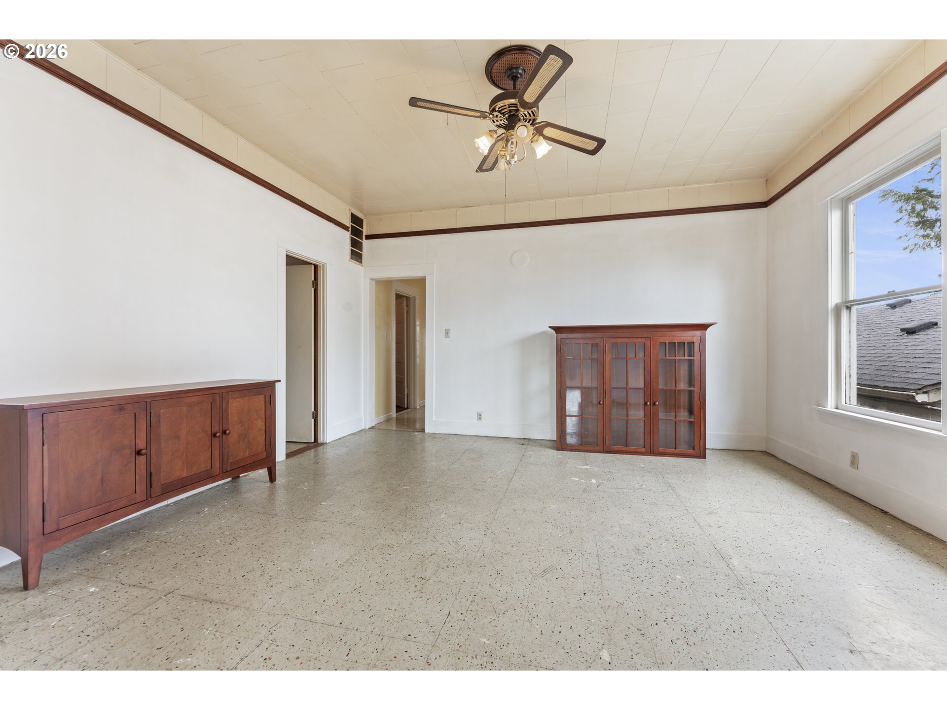 642 Clark Street North Bend, OR 97459 - Photo 8 of 29 a view of an empty room with cabinet and a ceiling fan
