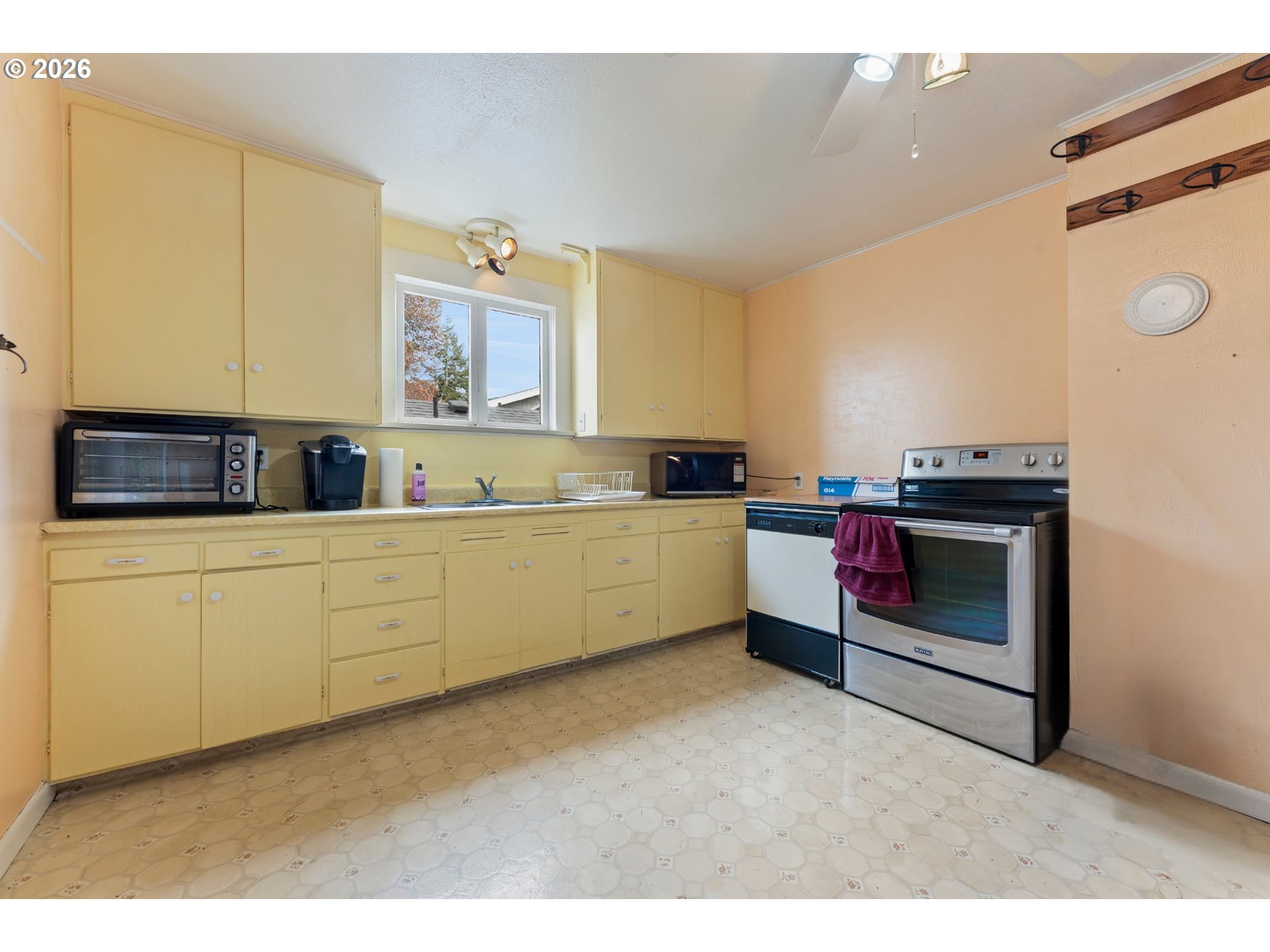 642 Clark Street North Bend, OR 97459 - Photo 9 of 29 a kitchen with a cabinets and white appliances