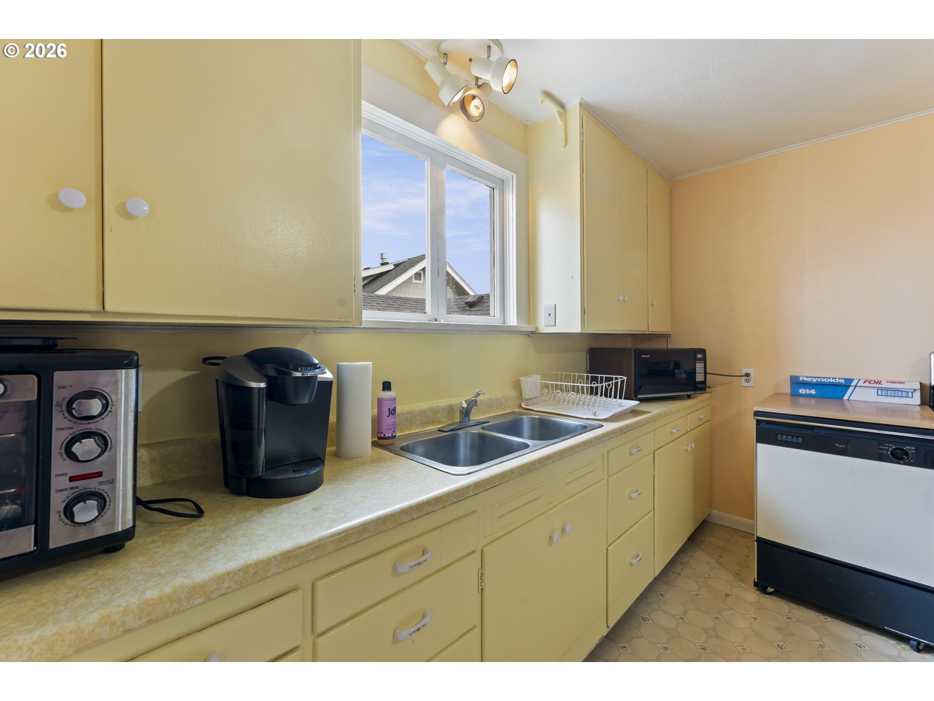 642 Clark Street North Bend, OR 97459 - Photo 10 of 29 a kitchen with a sink and cabinets