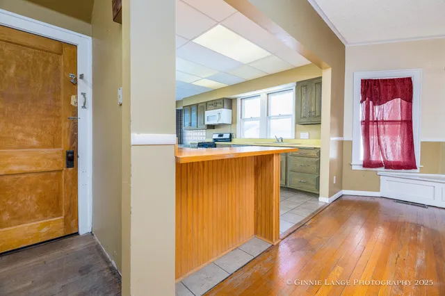 a kitchen with stainless steel appliances granite countertop a stove and a sink