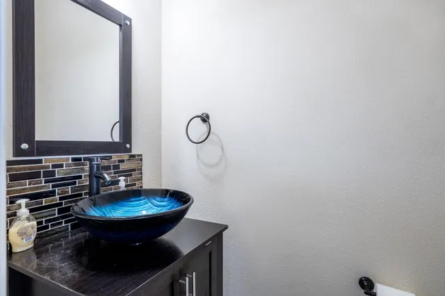 a bathroom with a sink and a mirror