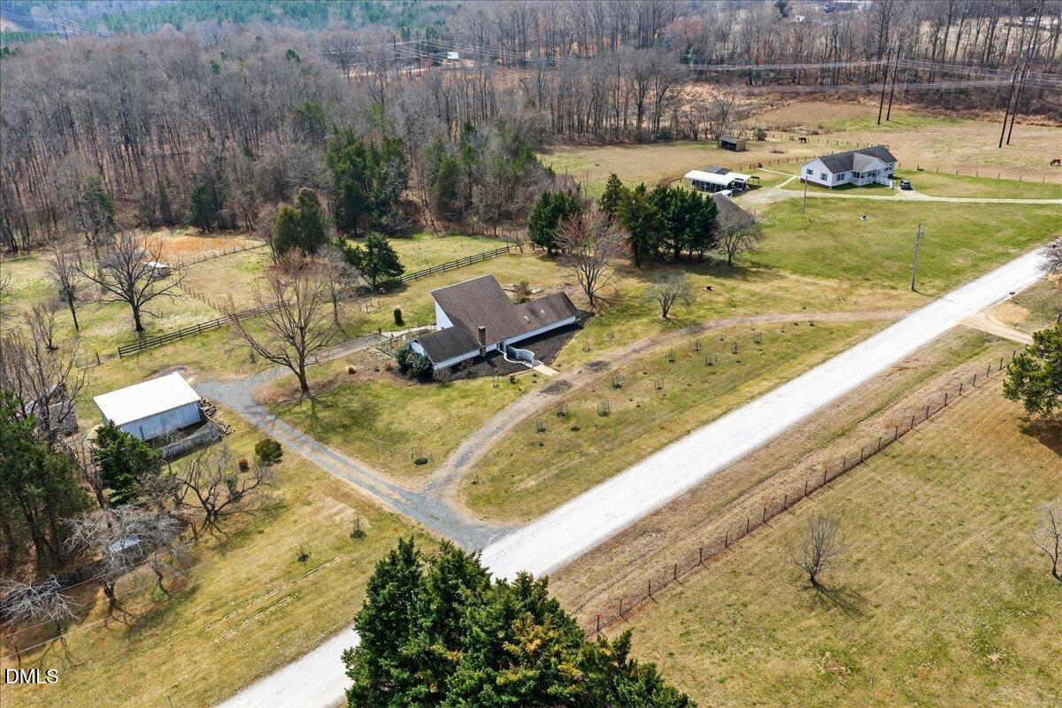 180 Manor Drive Timberlake, NC 27583 - Photo 3 of 85 a view of a swimming pool with a patio and a yard