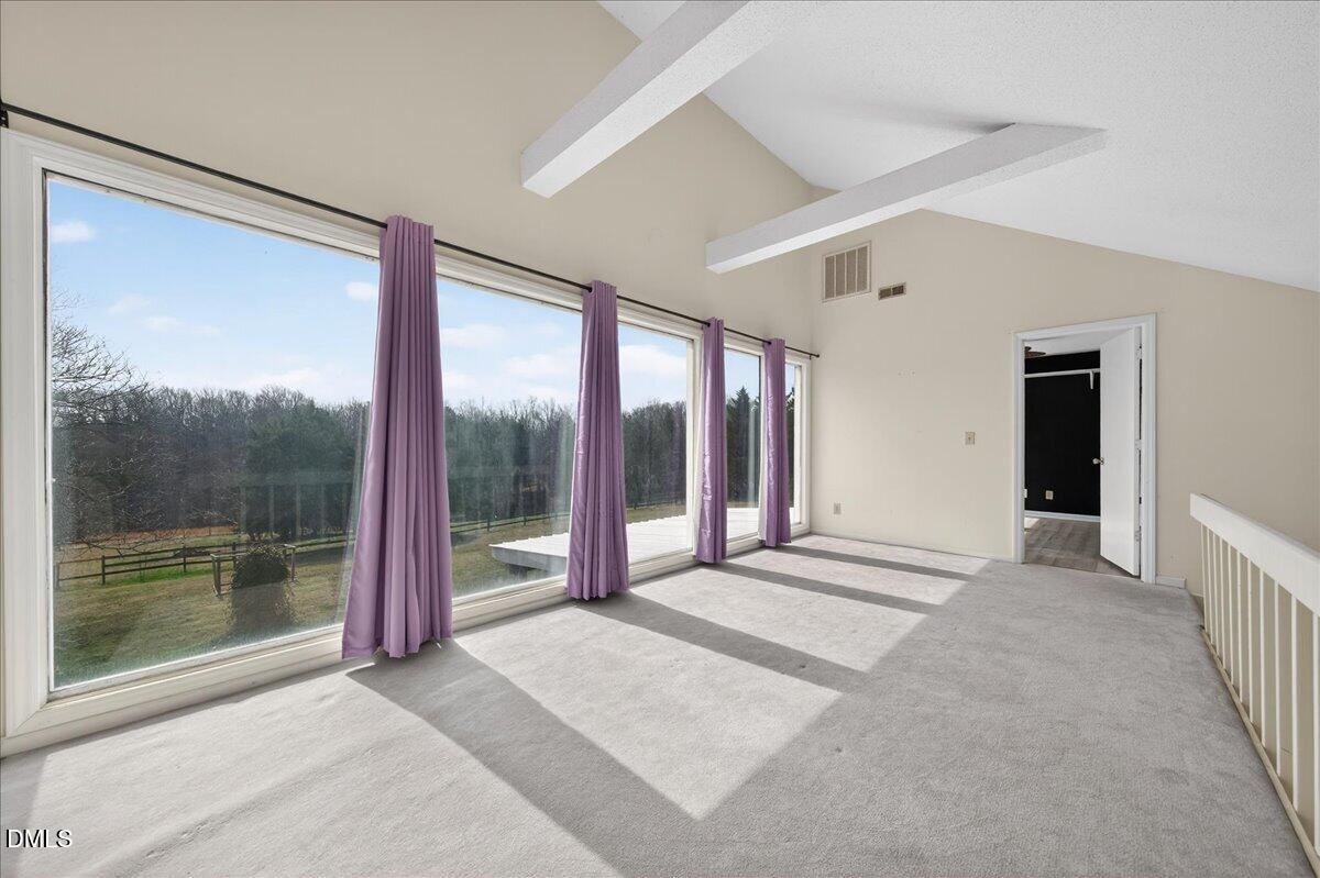 180 Manor Drive Timberlake, NC 27583 - Photo 44 of 85 a view of an empty room with sliding glass door