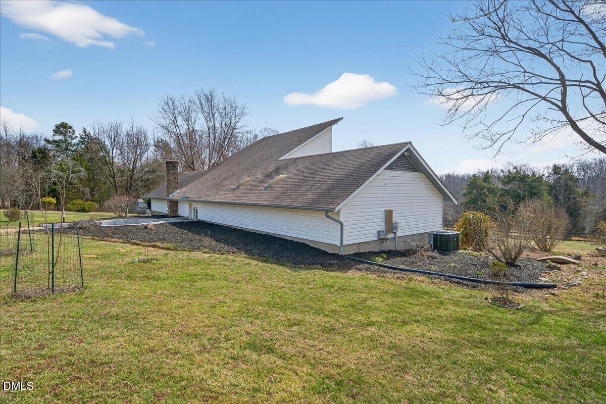 180 Manor Drive Timberlake, NC 27583 - Photo 56 of 85 a view of a house with pool and a yard