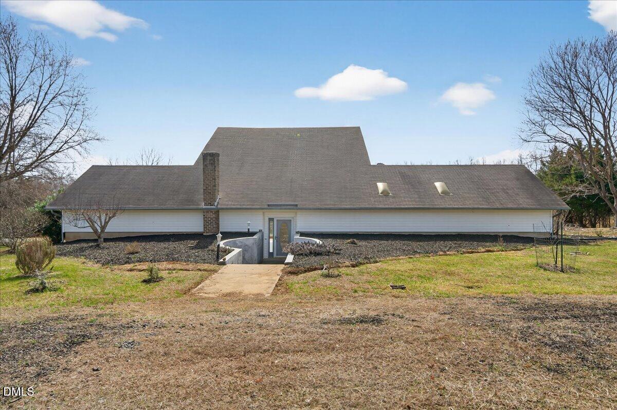 180 Manor Drive Timberlake, NC 27583 - Photo 57 of 85 a view of a house with a yard
