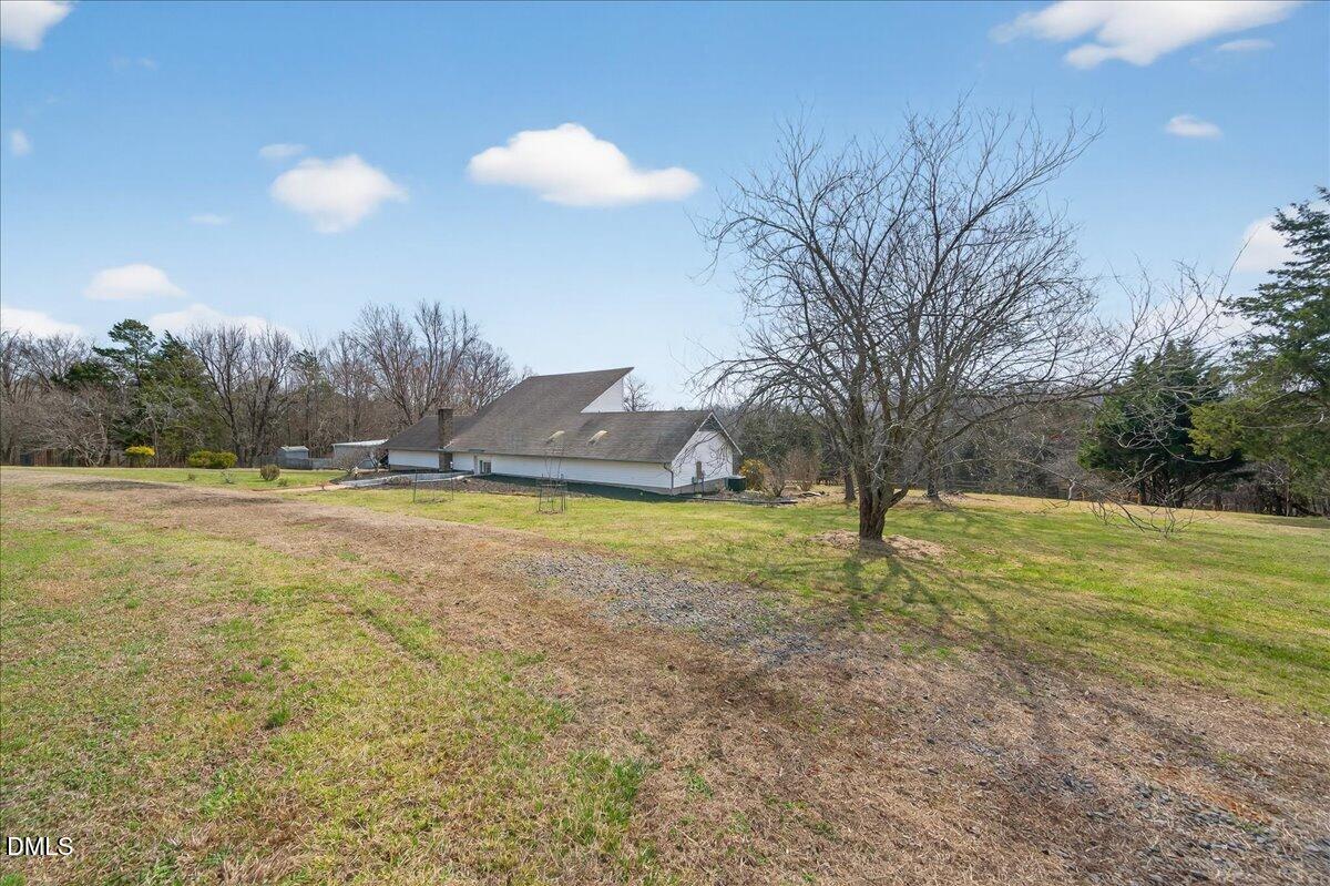 180 Manor Drive Timberlake, NC 27583 - Photo 59 of 85 a view of a swimming pool with an outdoor space and seating area